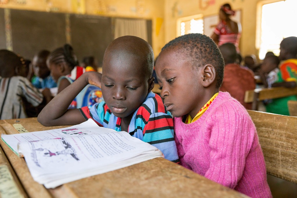 Children reading together in classroom